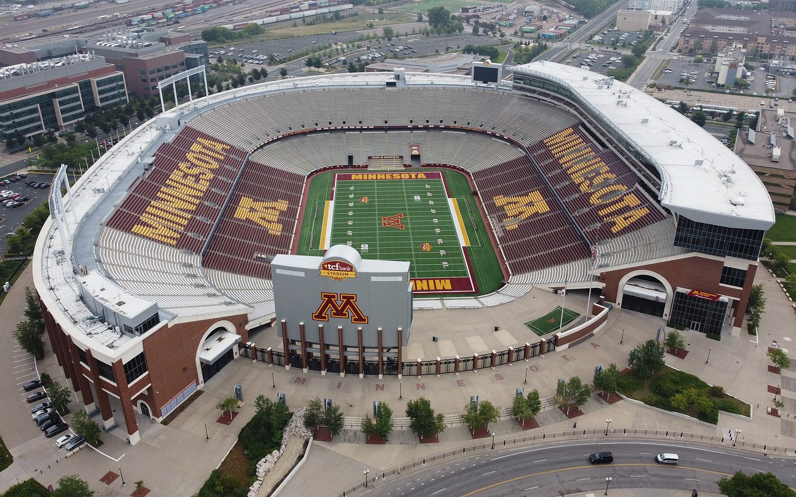 Aerial view of an empty Minnesota Golden Gophers football stadium surrounded by city streets